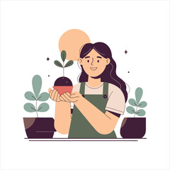 young girl holding a small plant