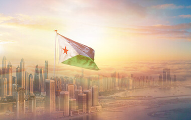 Djibouti national flag aerial view clouds in beautiful sky. Top view. Drone. Aerial bird's eye fly flag. Aerial top flag view cloudscape.  Flag with Sunrise or sunset over clouds.