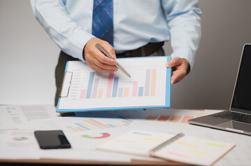 Businessman Analysing Financial Data and Business Growth Strategy with Chart