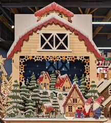 Granero con paisaje navideño con elfos, árboles de navidad y un pueblo de madera en estante de...