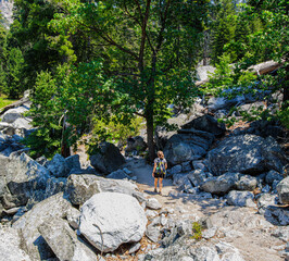 Female Hiker Crossing Through Boulders on The Zumwalt Meadow Loop Trail, Kings Canyon National Park, California, USA