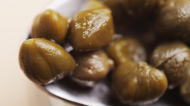 Pickled capers spanish food. Marinated buds of caper bush. Mediterranean cuisine ingredient. Organic spices and seasonings for meat, fish and vegetables, macro shot. Top view.
