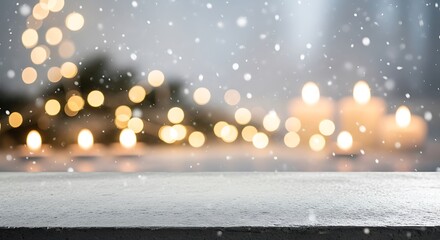 Empty wooden table with blurred candle lights and snow for christmas time