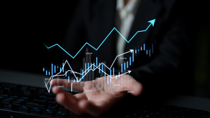 A business professional showcases a digital data visualization representing growth trends,...