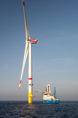 Offshore Wind Turbine Maintenance Vessel at Sea. Renewable Energy Industry, Sustainable Power, Wind...