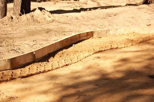 ready for laying asphalt, surrounded by  fores areas. Outdoor urban development