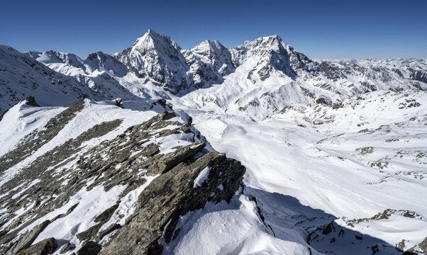 Mountain panorama with snow-covered mountain landscape in winter, view of mountain peaks Königsspitze, Monte Zebru and Ortler, summit of Madritschspitze, Ortler Alps, Vinschgau Valley, Italy