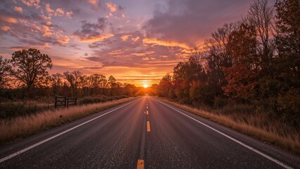 Fototapeta premium Sunset over deserted autumn road.