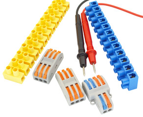 electrical terminal blocks and multimeter probes on white