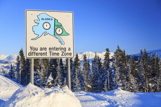 Sign, time zones, winter, snow, sunny, Haines Highway, Yukon, Canada