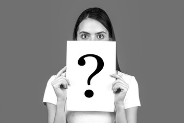 Woman holding paper question mark. Anonymous woman with question mark. Female person not identified by name, unknown faceless user, incognito. Black and white