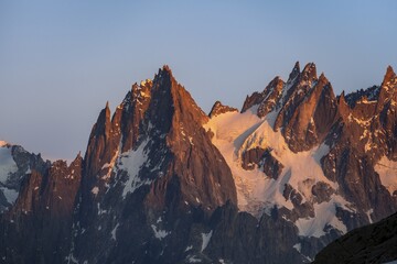 Rocky pointed mountain peaks at sunset, alpenglow, Aiguille du Plan, Mont Blanc massif, Chamonix, France