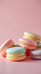 Fototapeta premium Several macarons are stacked on top of each other on a pink surface