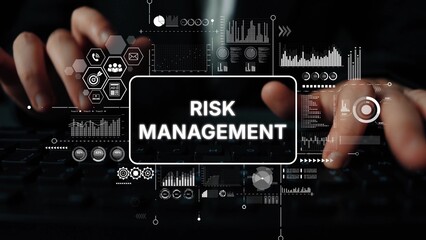 Professional Hands Typing on Keyboard with Risk Management Graphics and Data Visualizations in Modern Office Setting. Asymptotic smart data analytic.