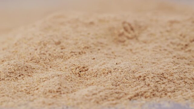 Ashwagandha Indian Ginseng Powder in White Bowl isolated on white background, superfood close up. 