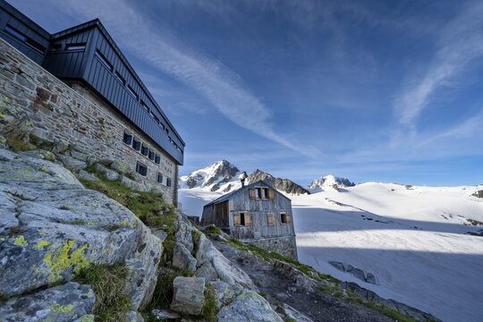 Old and new mountain hut Refuge Albert 1er, high alpine mountain landscape, summit of the Aiguille de Chardonnet and Glacier du Tour, glacier and mountain peaks, Chamonix, Haute-Savoie, France