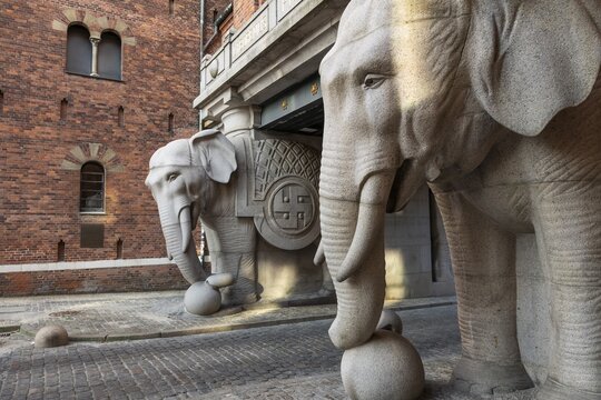 Monumental stone elephants with Indian swastika, elephant gate or elephant portal or elephant portals, designed by architect Vilhelm Dahlerup, Carlsberg district, Copenhagen, Denmark