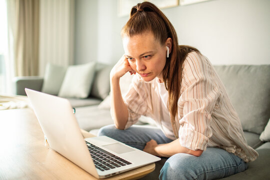Young woman using laptop at home