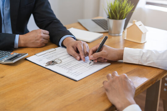 Asian tenant, client man sign signature contract rental purchase, buyer home or apartment with landlord, realtor after banker agreement mortgage, loan success or done. Property lease agent concept.