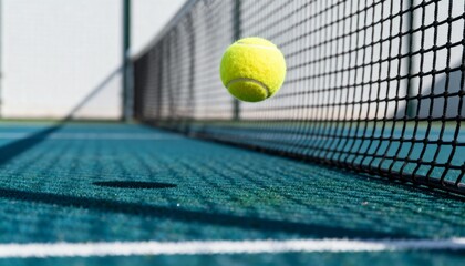 Tennis ball bouncing over court net