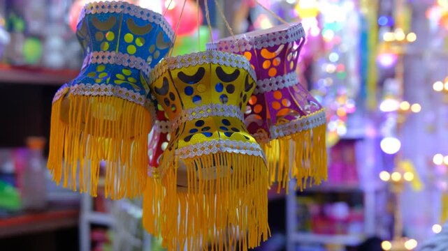 Colorful traditional Lanterns in Various Shapes Akash kandil (Diwali decorative lamps) Hang out side shop for sale celebrating Diwali Festival. stock video footage.