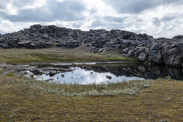 Naklejka premium The rock formations and lake in Iceland