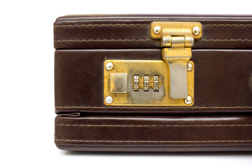 A vintage brown leather suitcase with gold latches isolated on a white background. This suitcase is usually used for business trips.