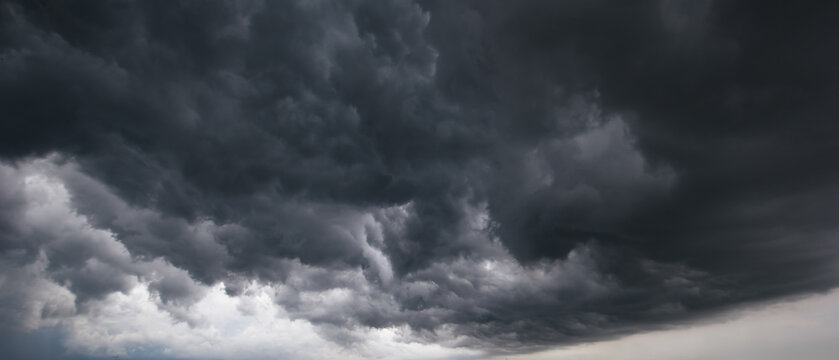 Dark storm clouds gathering in the sky, symbolizing danger, power, and dramatic weather before heavy rain or thunderstorm. Perfect for concepts about nature, climate change, and emotional tension.
