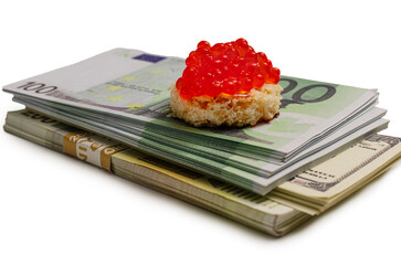 Red Caviar on Stacked Euro and Dollar Banknotes