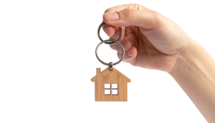 A person hand holding a house-shaped keychain