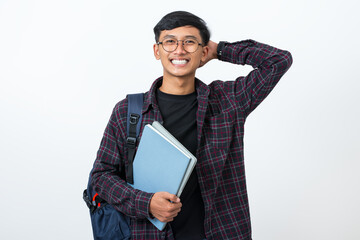 Smiling college student portrait with books and backpack on white background