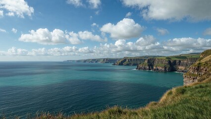 Fototapeta premium Landscape in Ireland with cliffs and ocean under cloudy sky