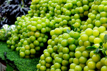 Green grapes that are being sold in the night market