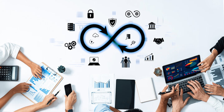 An engaging collaborative workspace showcasing business charts and technology icons. Perfect for illustrating teamwork in a modern office setting focused on data analysis and innovation. Trope