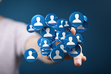 Person's hand holding a network of connected user icons, symbolizing social media, networking, and digital connections.