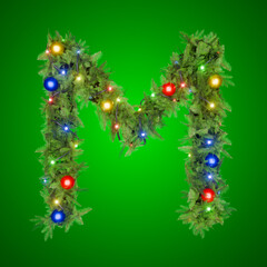 Letter M shines in Christmas lights on green backdrop