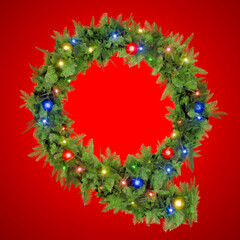 Letter Q shining in a Christmas garland adorned with lights.