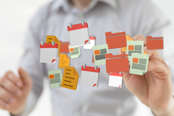 Concept of digital data management, with a person interacting with virtual documents, folders and...