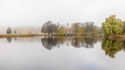 Autumn river in a foggy morning. Farnebofjarden national park in north of Sweden.