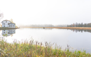 Autumn river in a foggy morning. Farnebofjarden national park in north of Sweden.