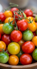 A close-up showcases a variety of ripe, vibrantly colored small tomatoes, resting in a wooden bowl, ready for use