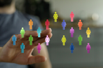 Abstract image depicting diverse individuals, teamwork and community, emphasizing connection and collaboration with a hand gesture. Great for bu