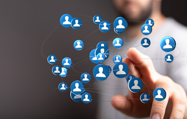 Close up of a hand interacting with a digital network concept, representing connection, communication, and social interaction.