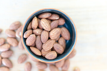 Roasted almond in small bowl from above