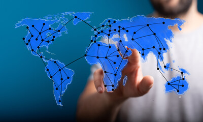 An interactive world map featuring a digital network, symbolizing global connectivity, data...