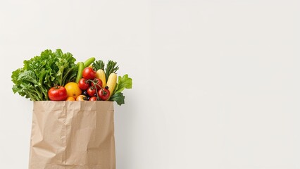 Fruits and vegetables in a Kraft bag from the store on a light background. Healthy and fresh food from the farmers' market. Space for text