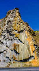 travertine waterfall wide angel shot, with mineral waters, the waterfall turned into chalky and colorful travertines.