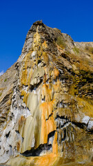 travertine waterfall wide angel shot, with mineral waters, the waterfall turned into chalky and colorful travertines.