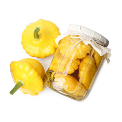 Pickled pattypan squashes in glass jar and fresh vegetables isolated on white, top view