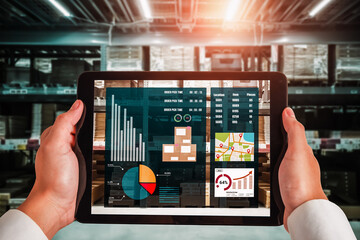 Warehouse management innovative software in computer for real time monitoring of goods package delivery . Computer screen showing smart inventory dashboard for storage and supply chain distribution .